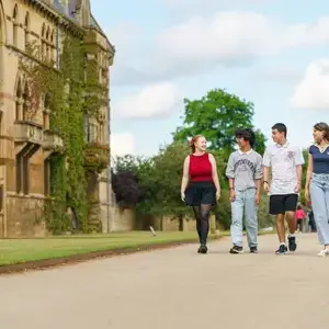 Students walking on campus and talking