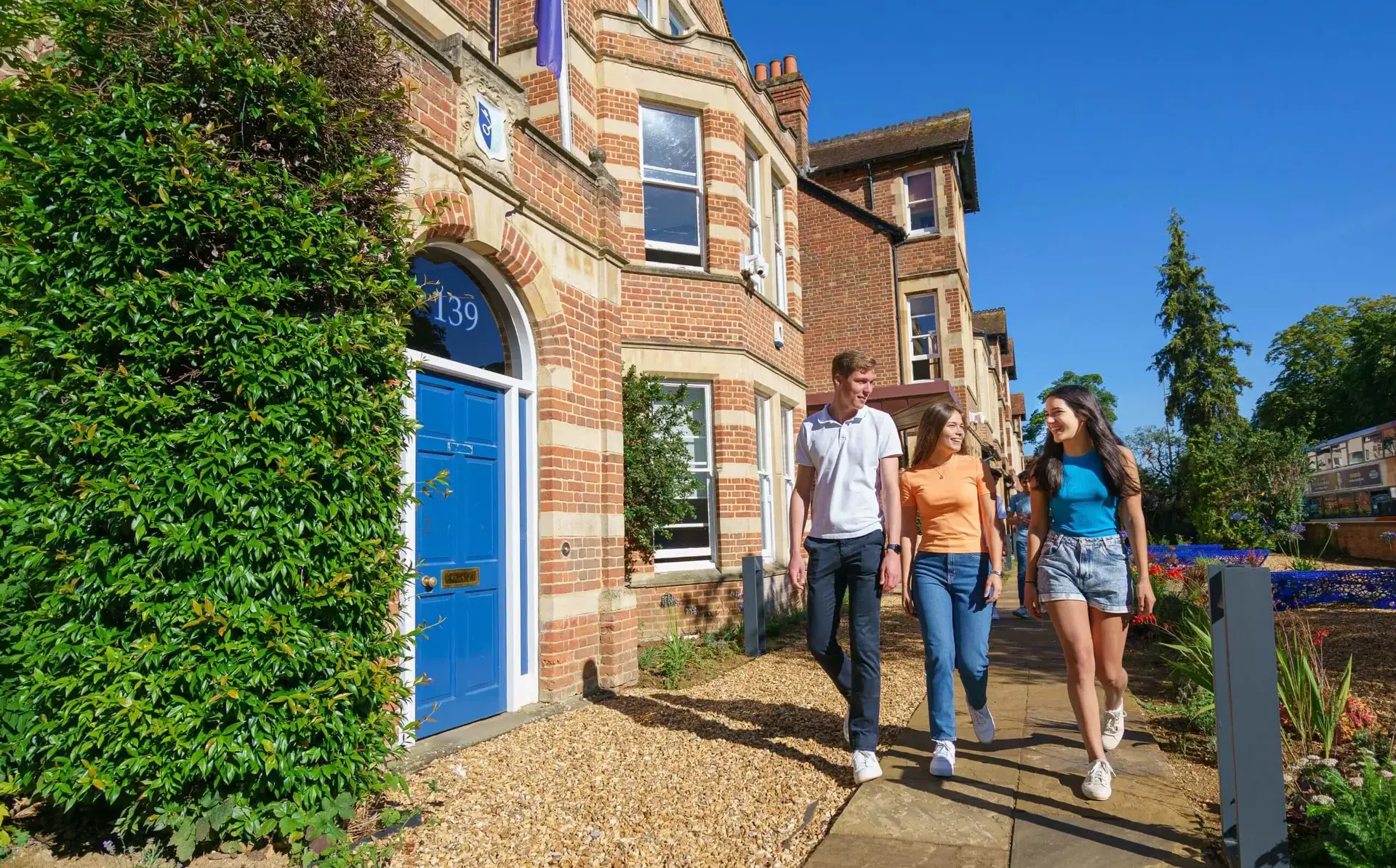 Students walking outside St Clare's building