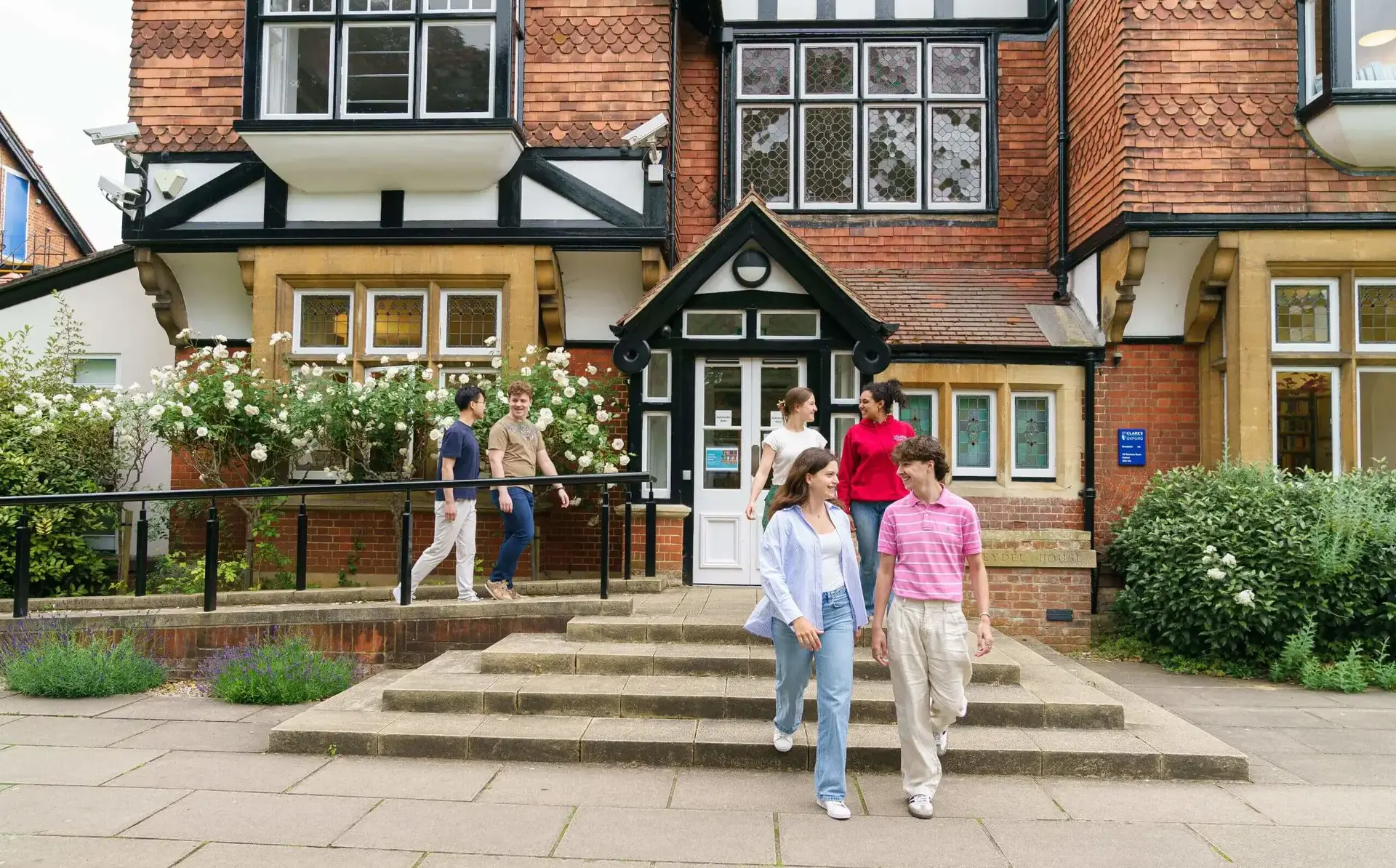 Students walking near entrance to St Clare's building