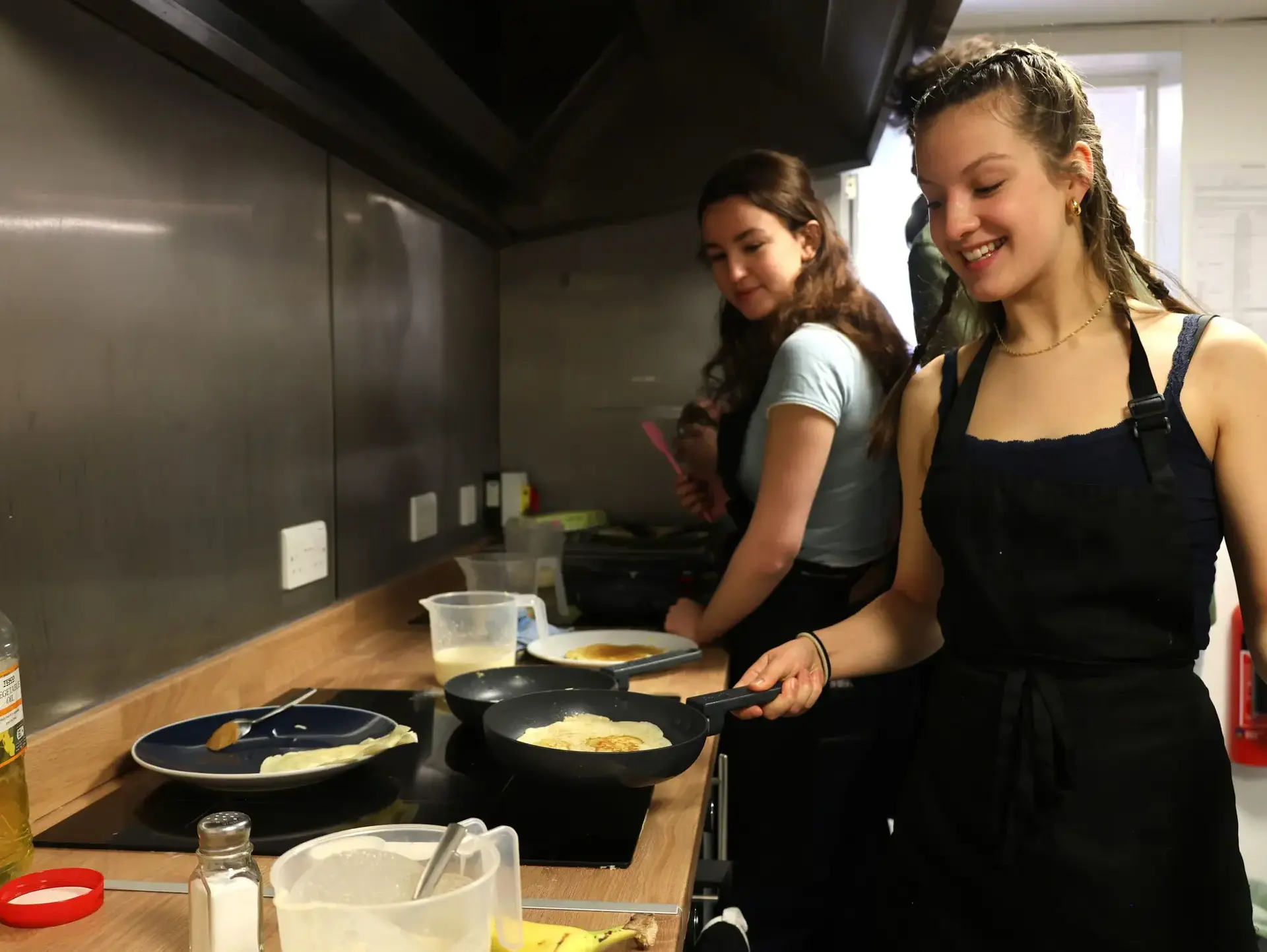 Students cooking in professional kitchen
