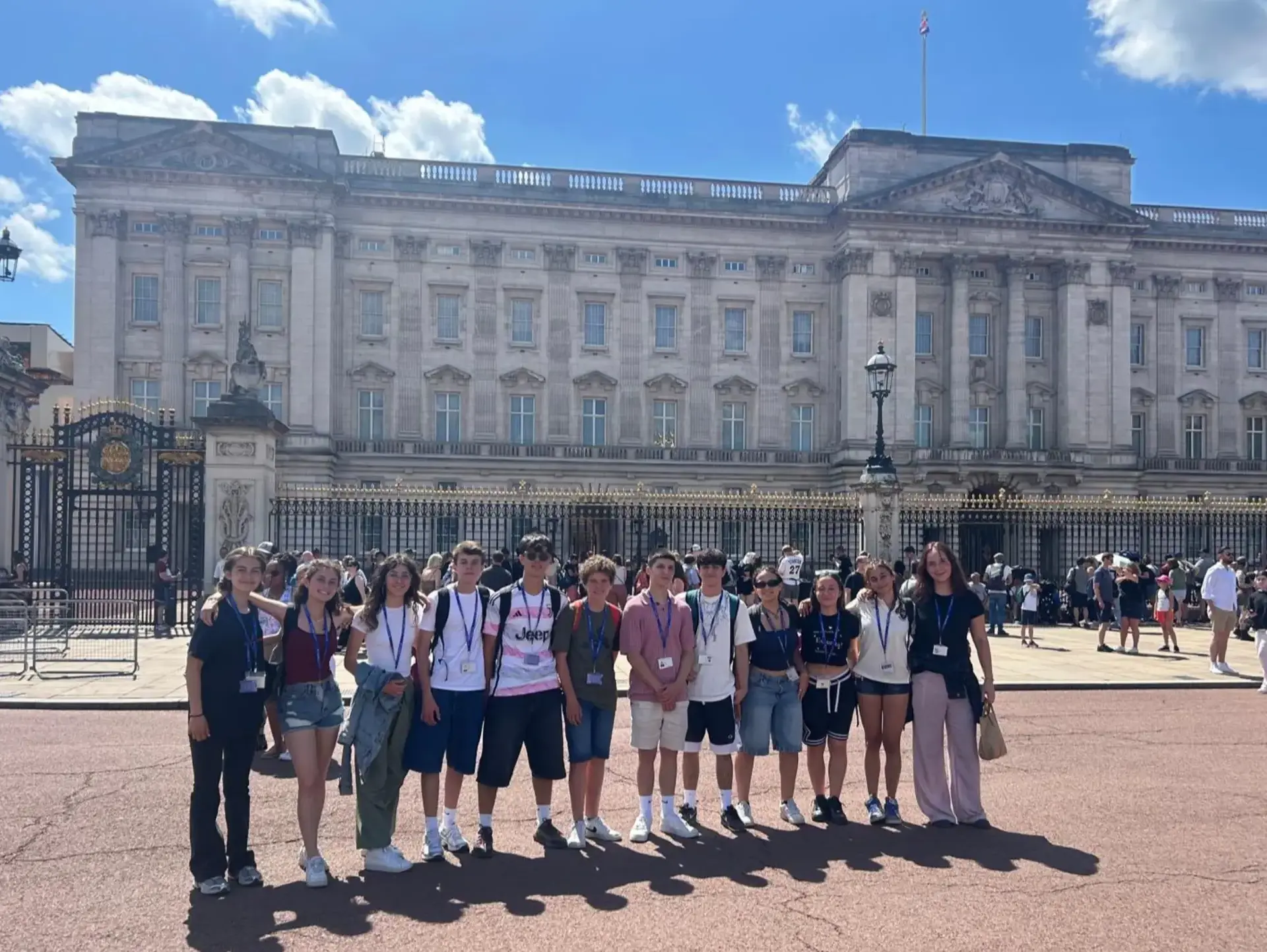 Students posing for photo outside Buckingham Palace