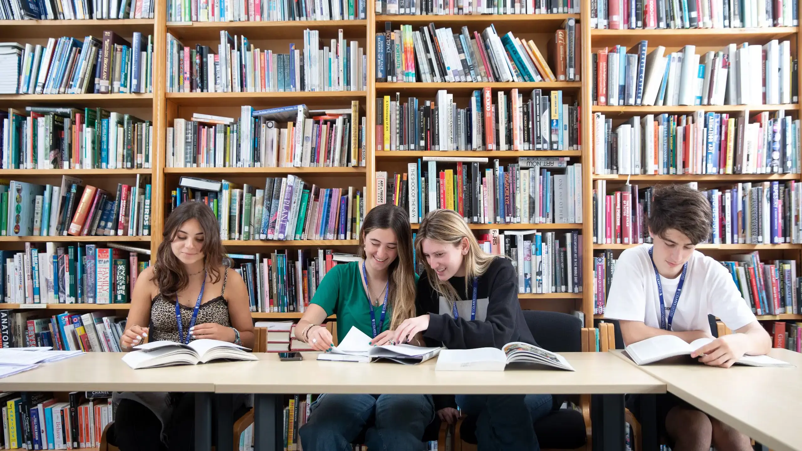 Four students working collaboratively in library