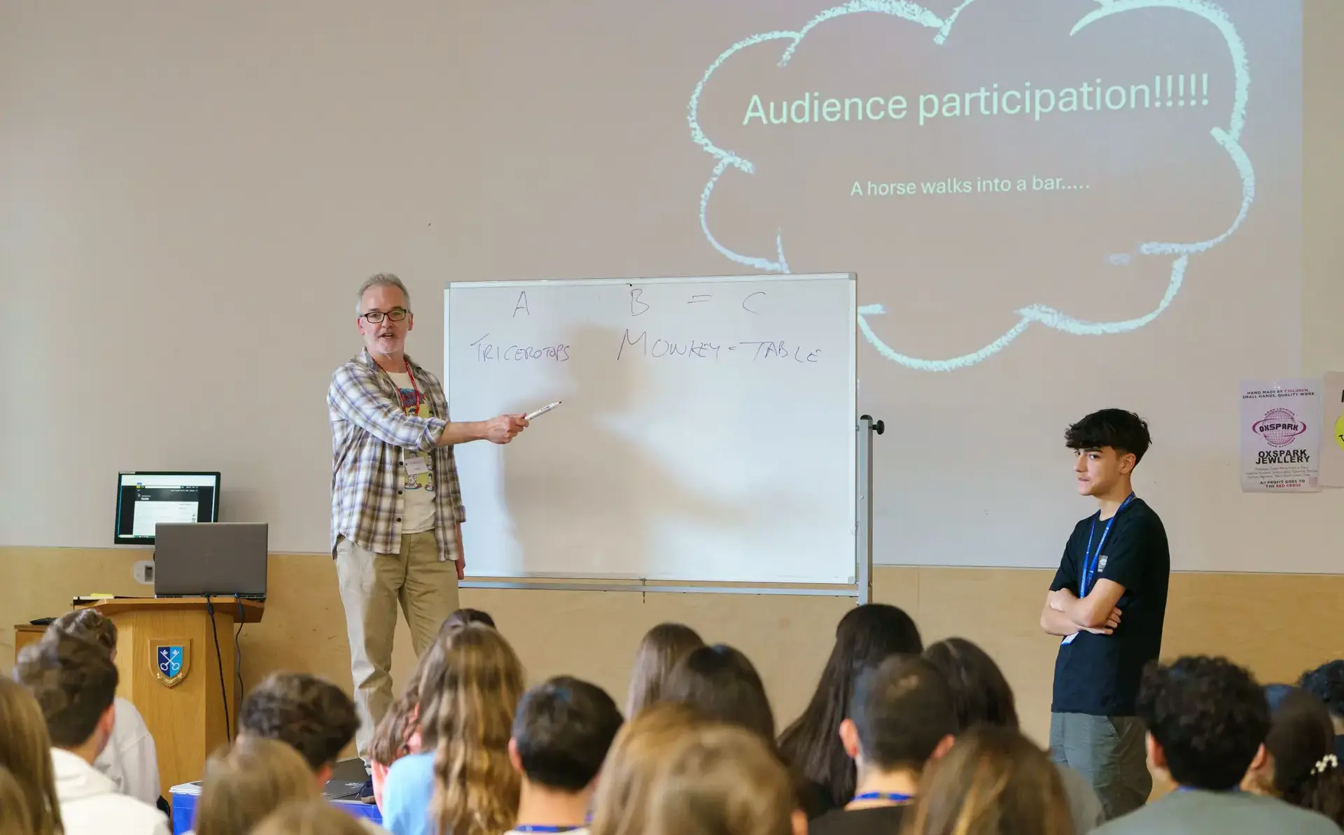 Teacher giving presentation using whiteboard and projector