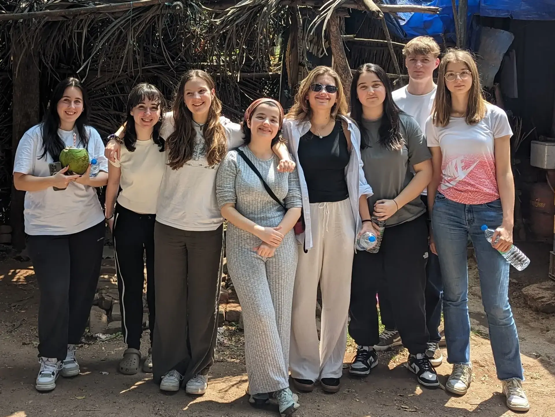 Students posing for group photo on sunny day