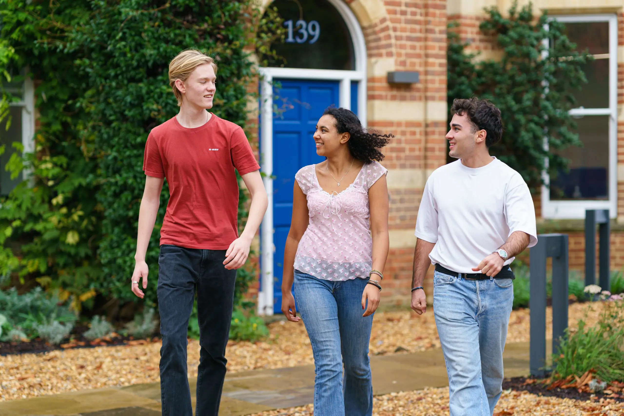 Nina and friends walking through campus