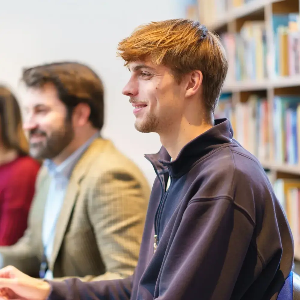 Trainee teachers smiling in library