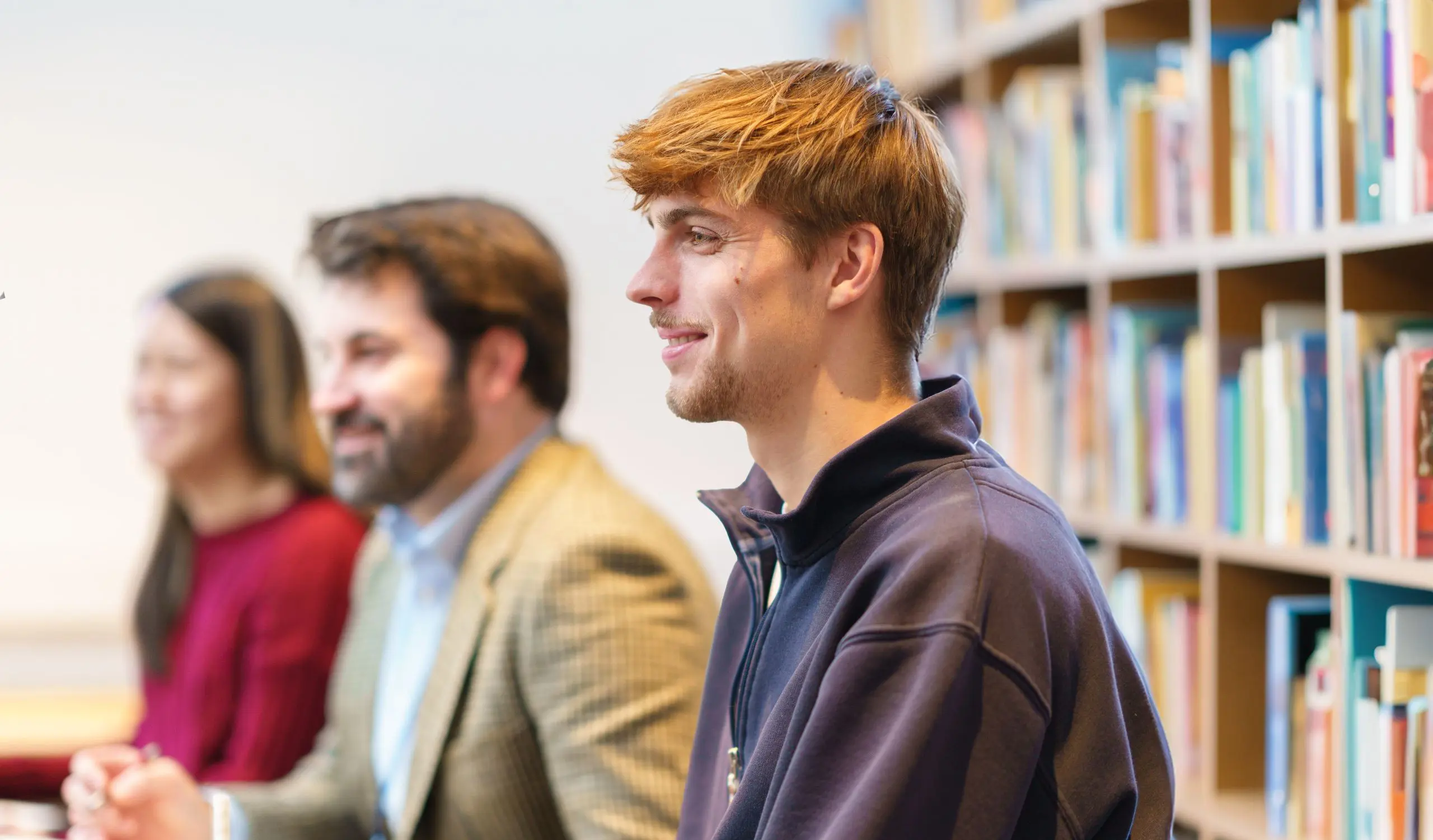 Student smiling in library