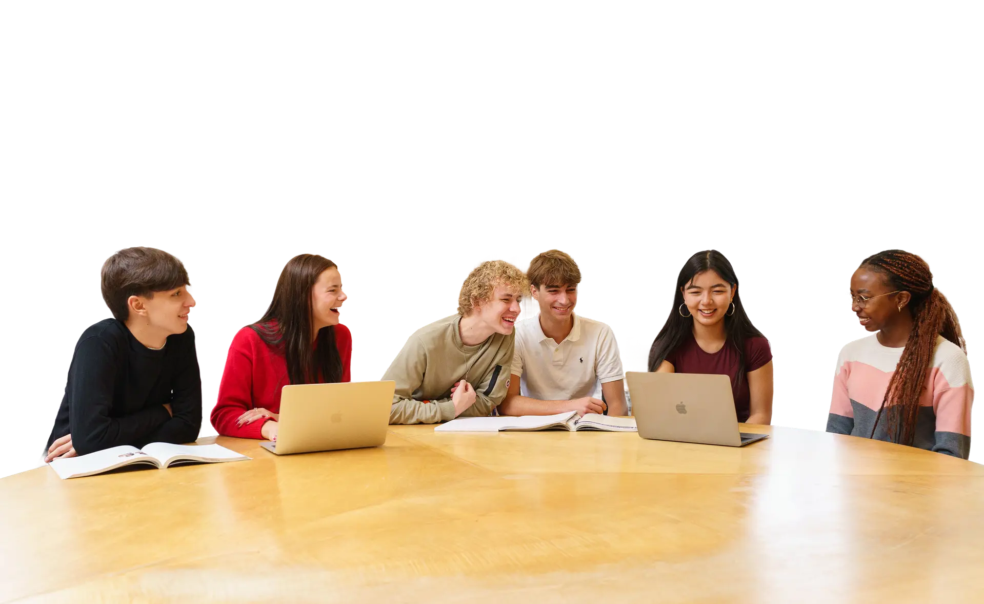 Several students sat at table with their laptops 