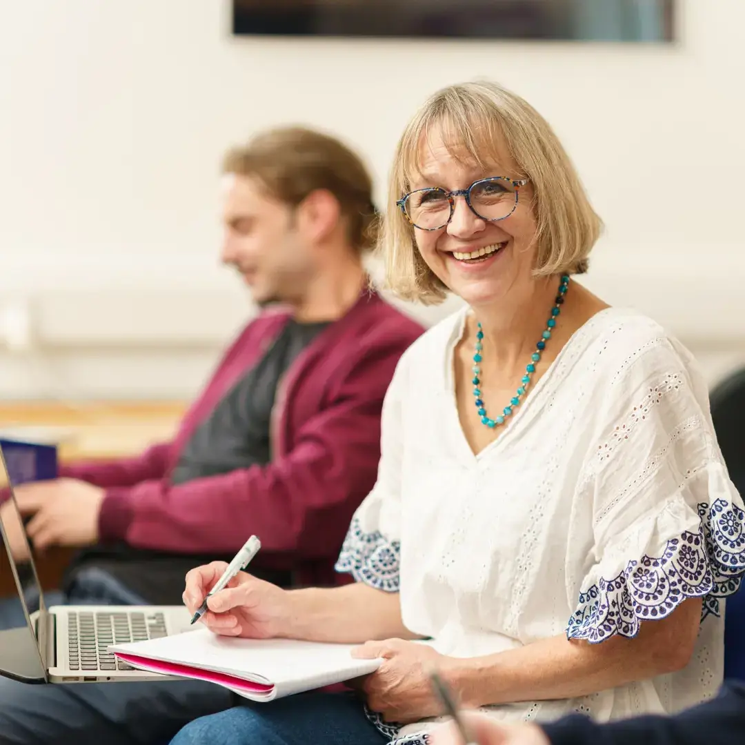 Female trainee smiling in class
