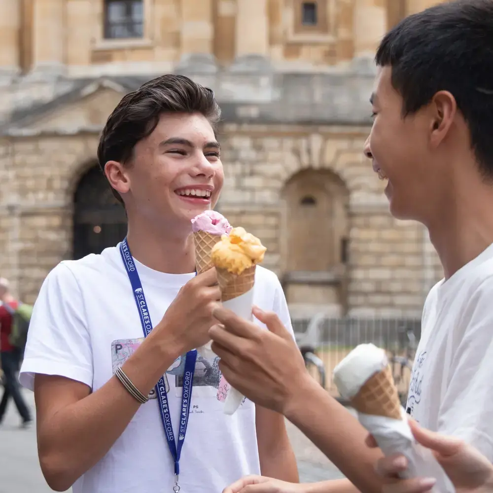 Students having ice cream in historical Oxford