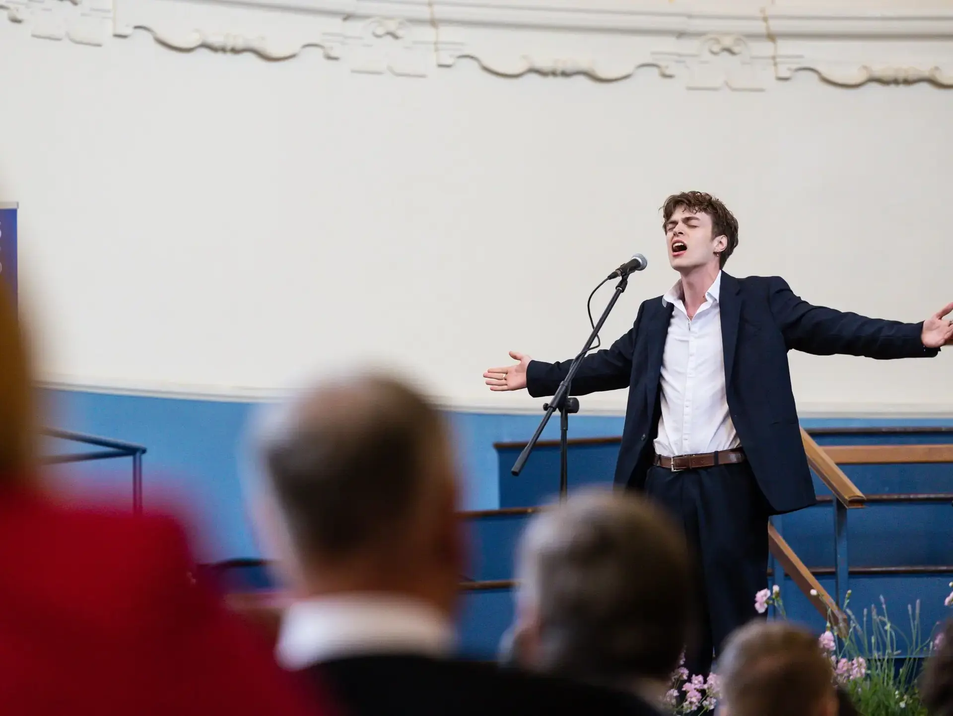 Student singing onstage