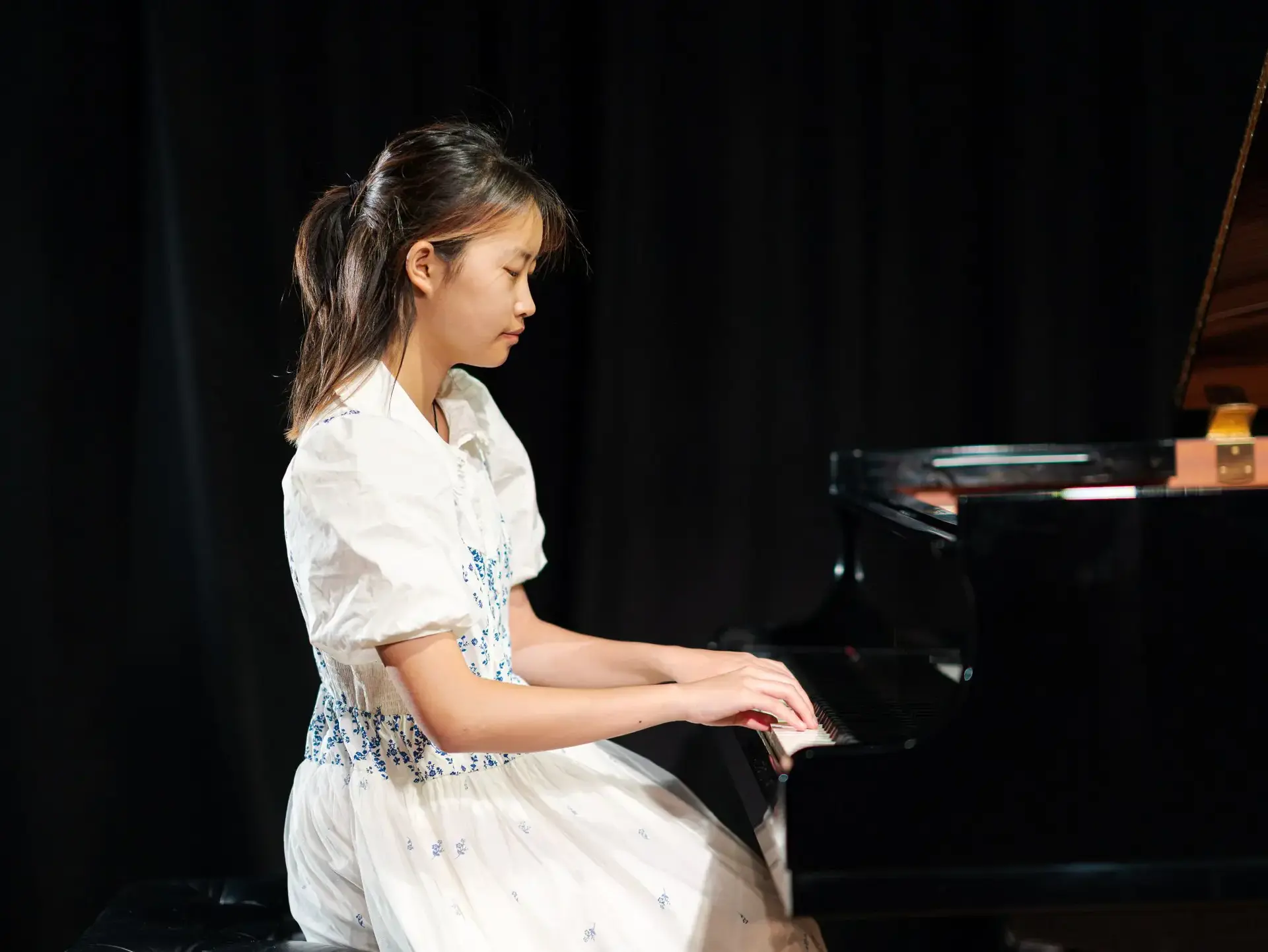 Student playing piano