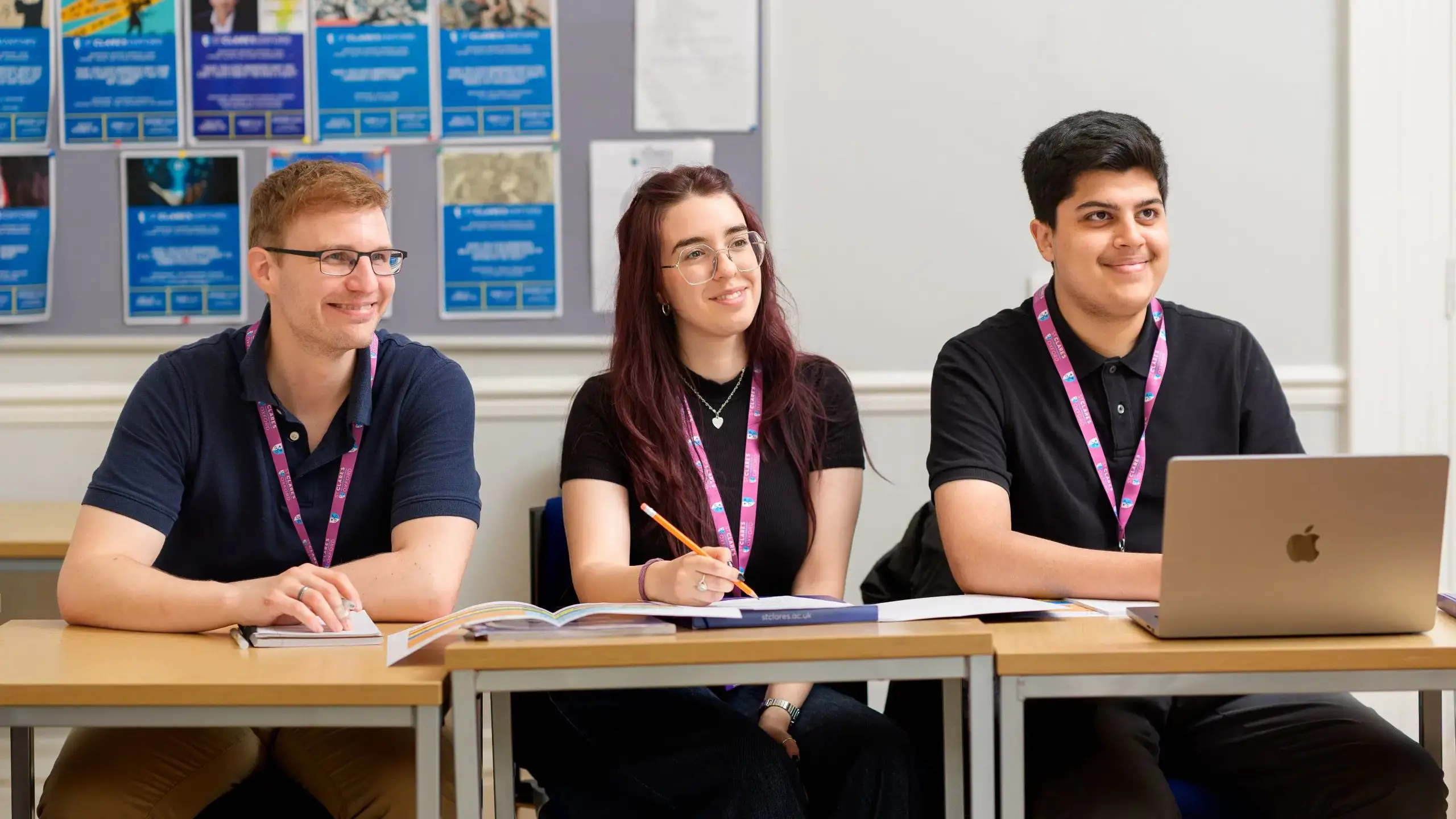 Students smiling up from their work
