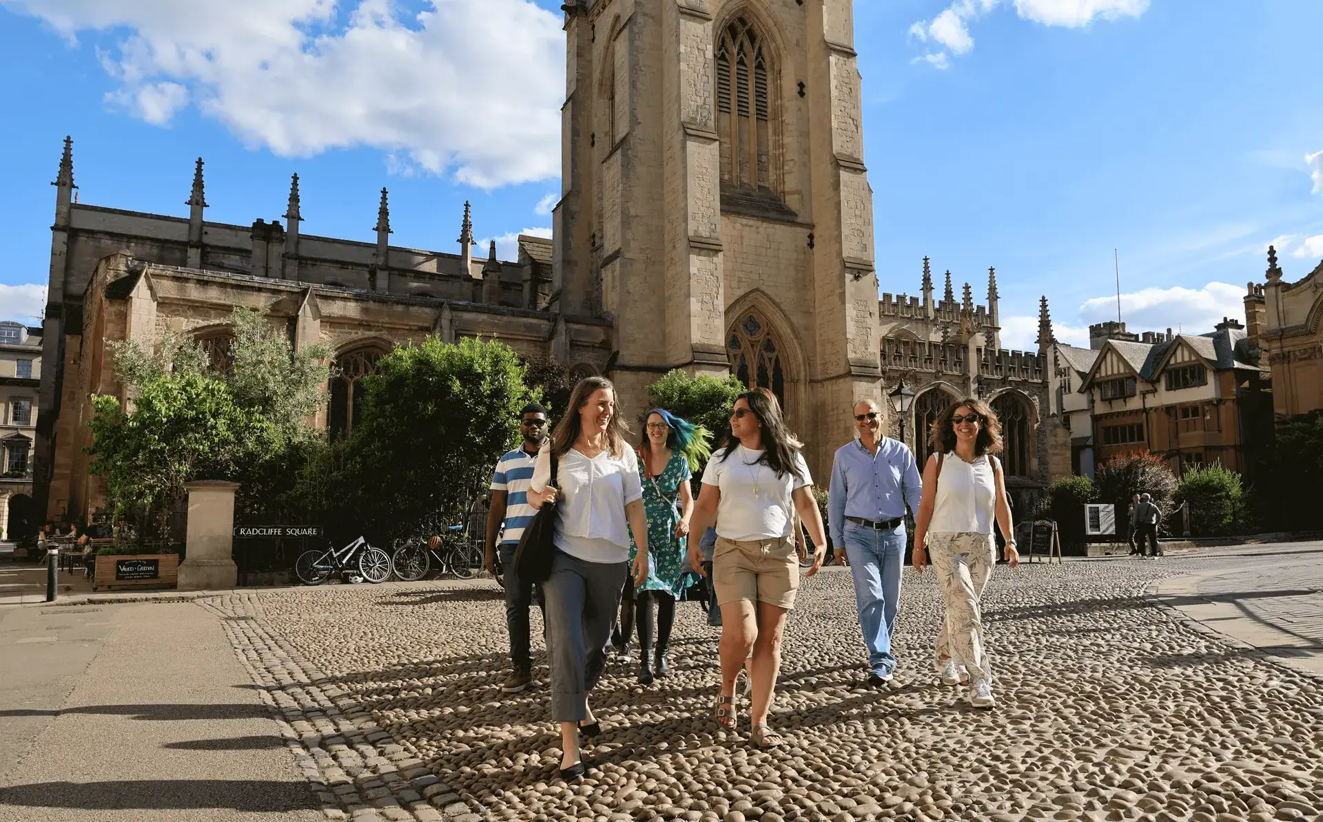 Teachers walking on a cobbled street in Oxford