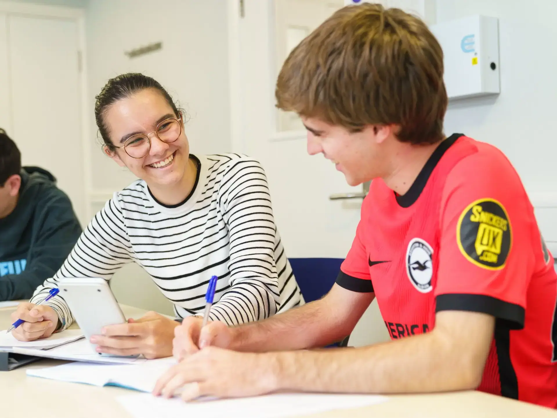 Students chatting at desk