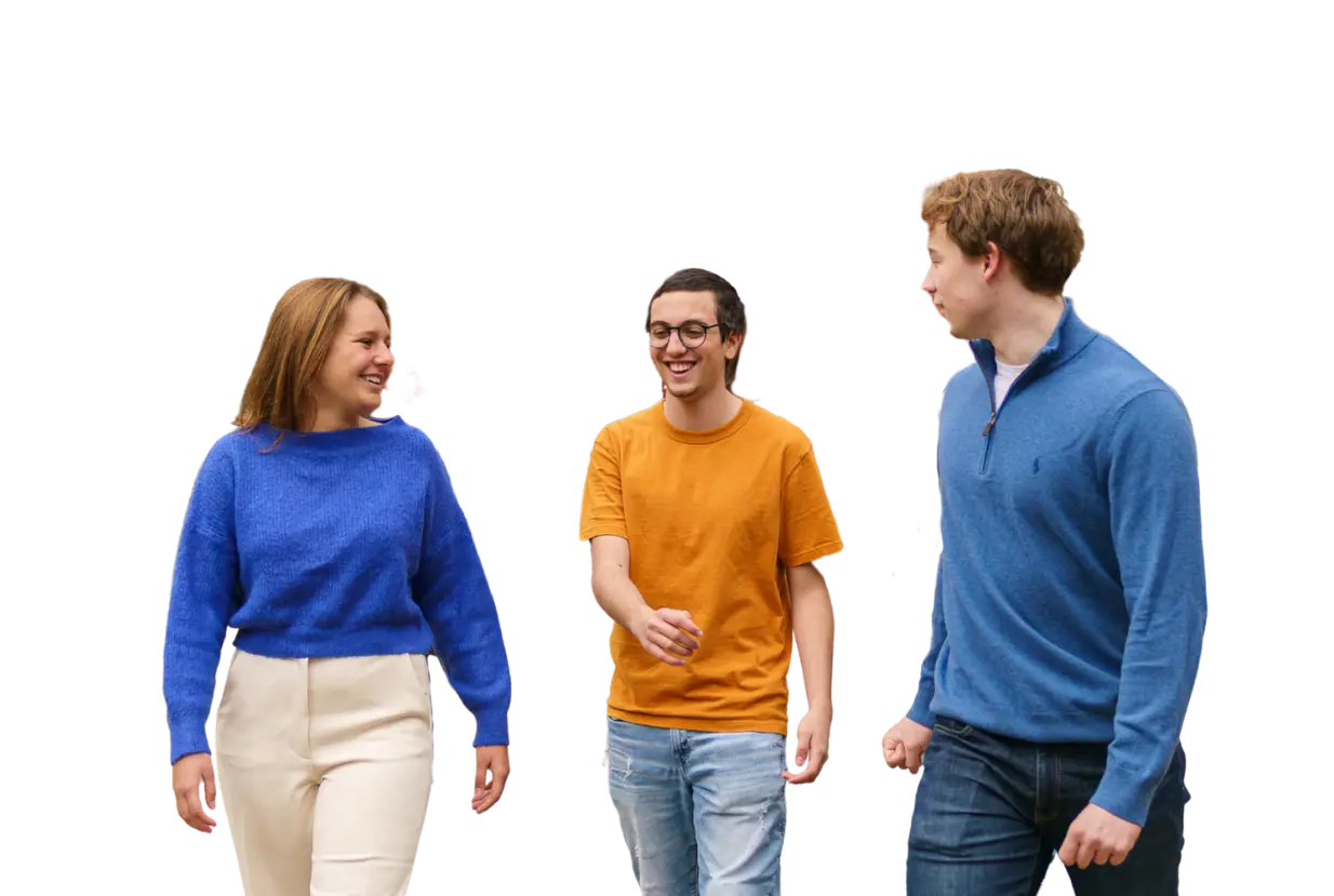 Group of happy students walking outside campus