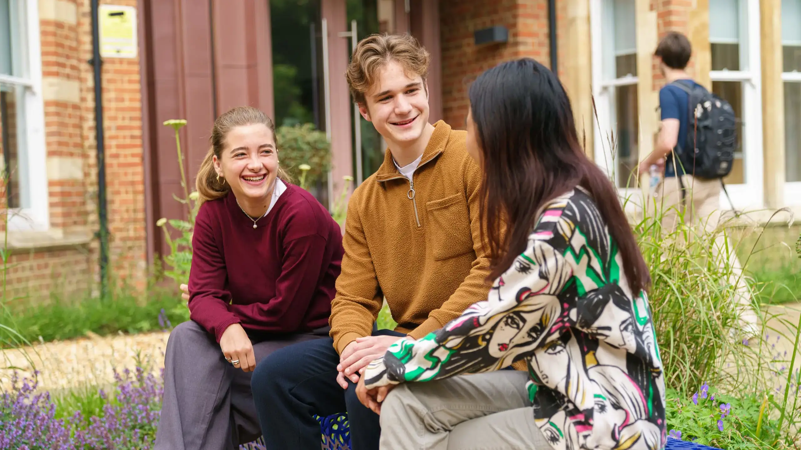 Students Talking and Smiling on Campus