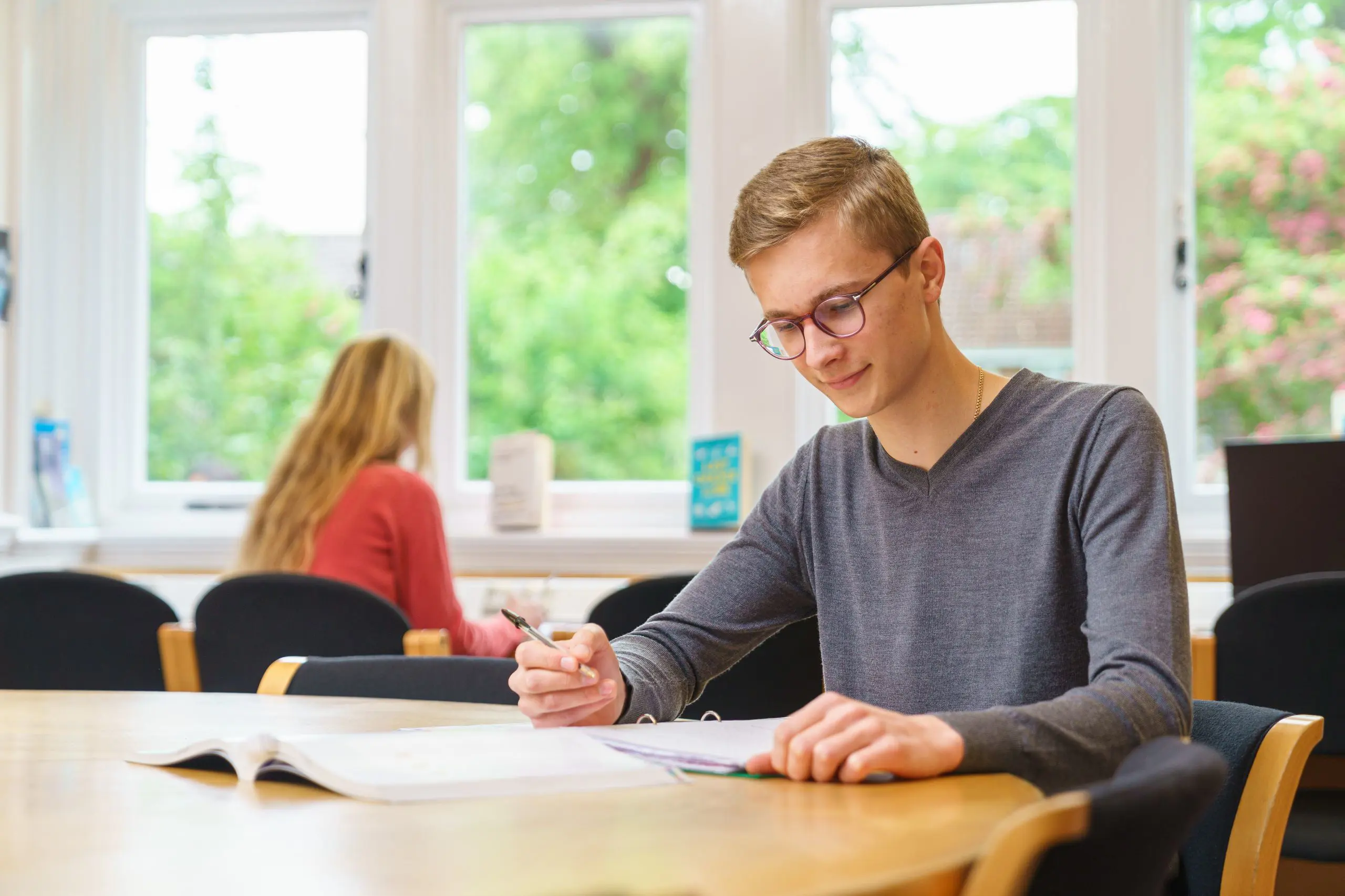 Student revising in library