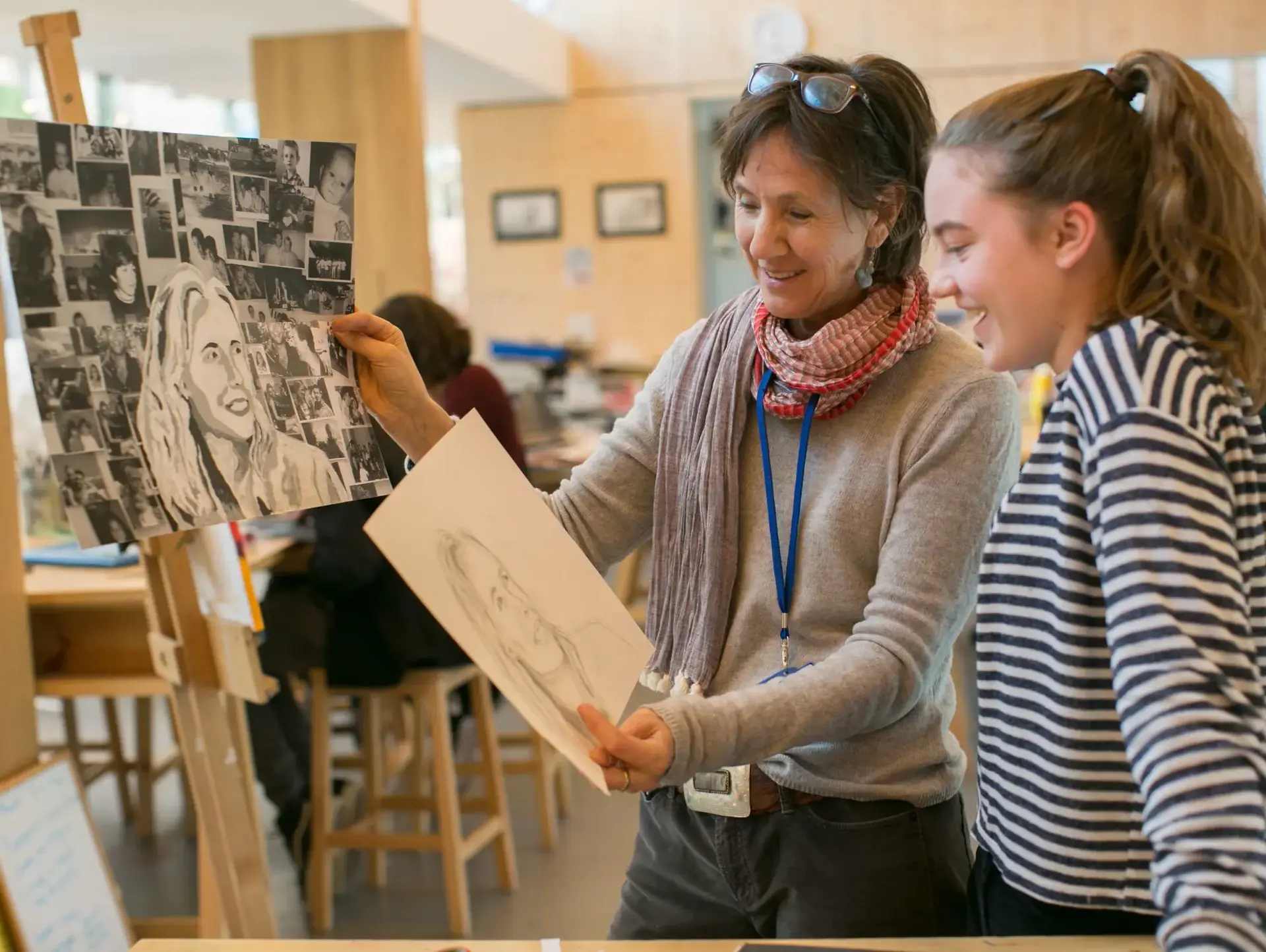 Two students looking at easel