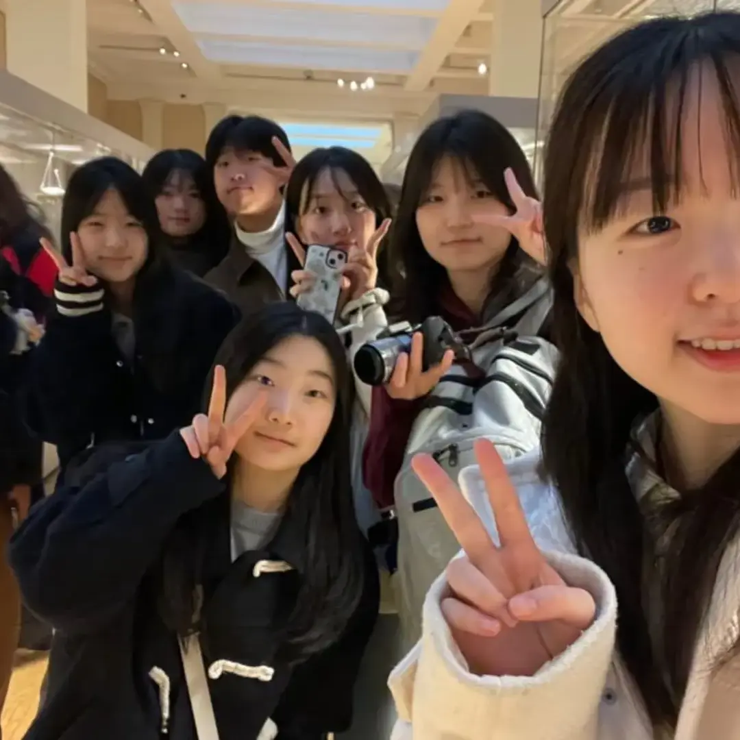 Group of students taking a selfie in a museum